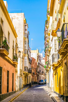 A narrow street in historical center of Cadiz, Spain by Pavel Dudek